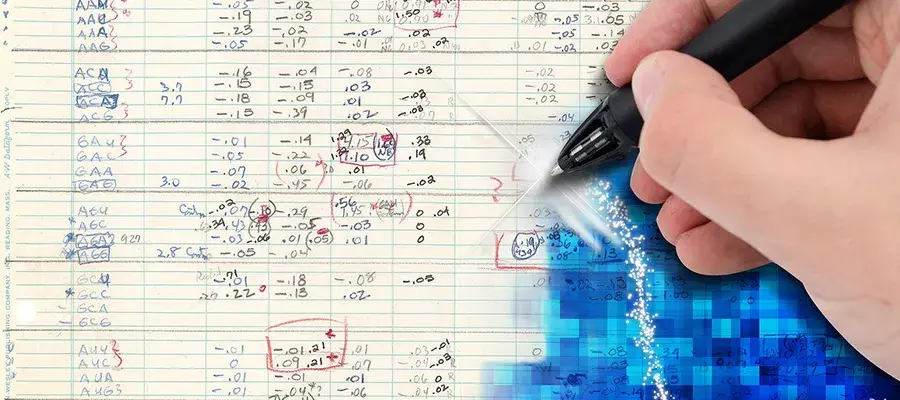 Someone writing on graph paper